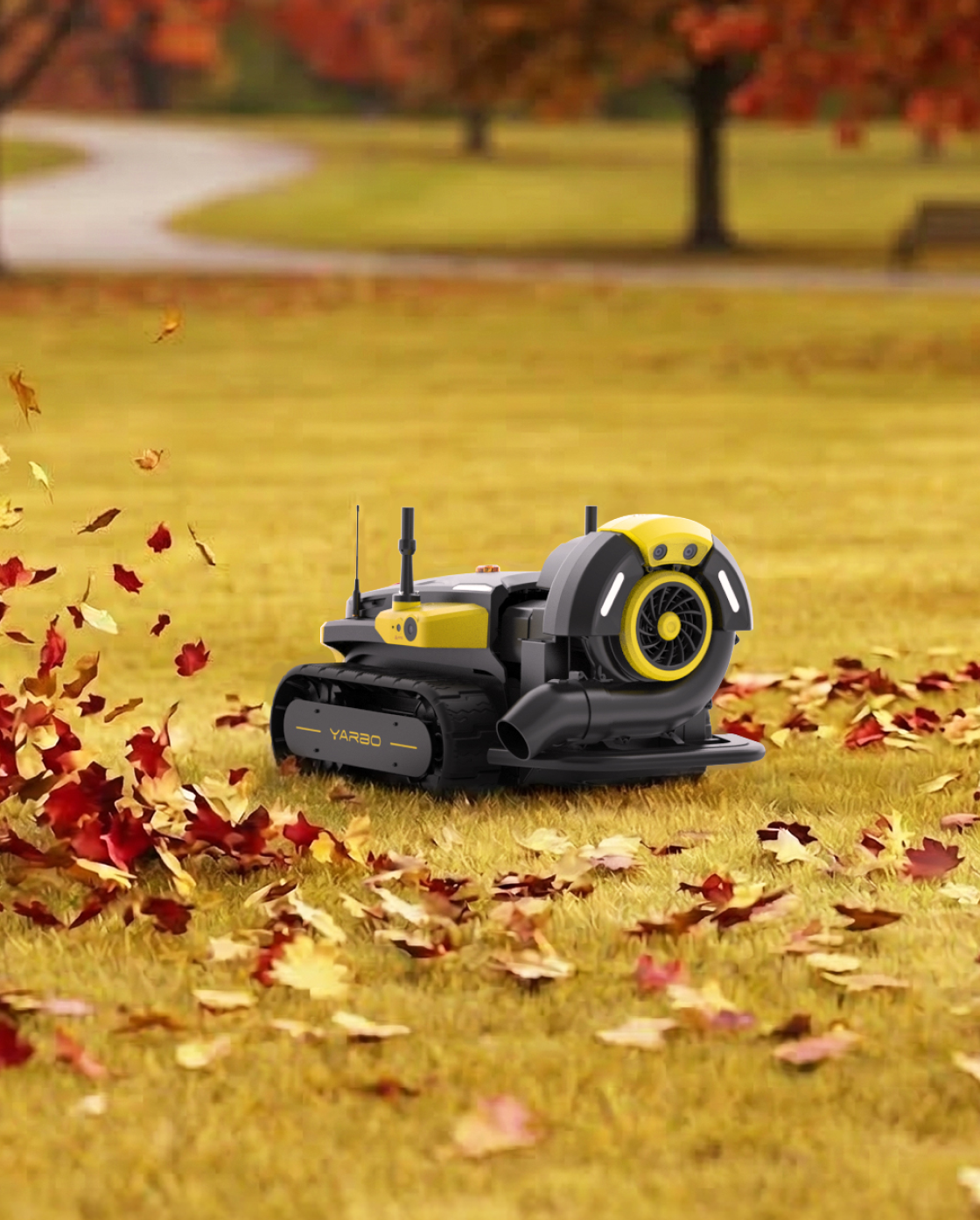 Black and yellow robotic lawn mower with blower attachment by Yarbo, on grass with autumn leaves, side view