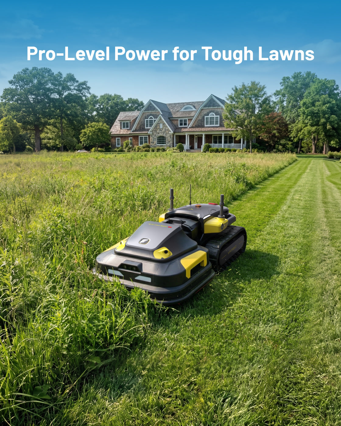 Robotic lawn mower module with black and yellow body, tank-style treads, and antennas, shown mowing tall grass in a large yard with a house in the background.