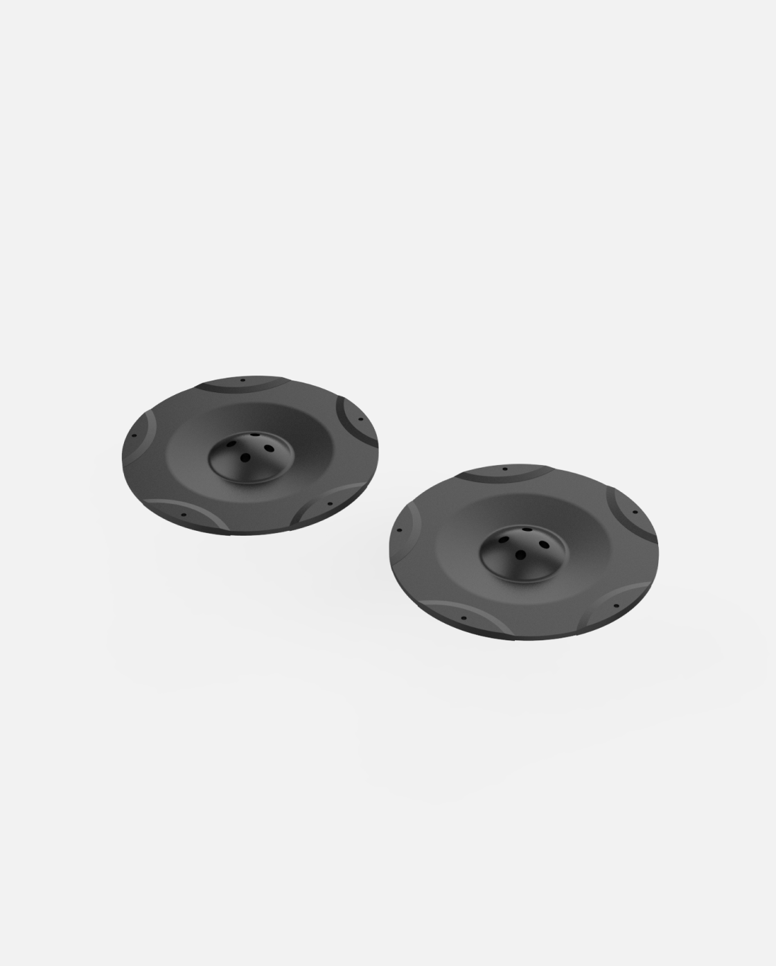 Two black cutting discs with central bolt holes and raised edges, shown from top view, for Lawn Mower Pro Module Y Series