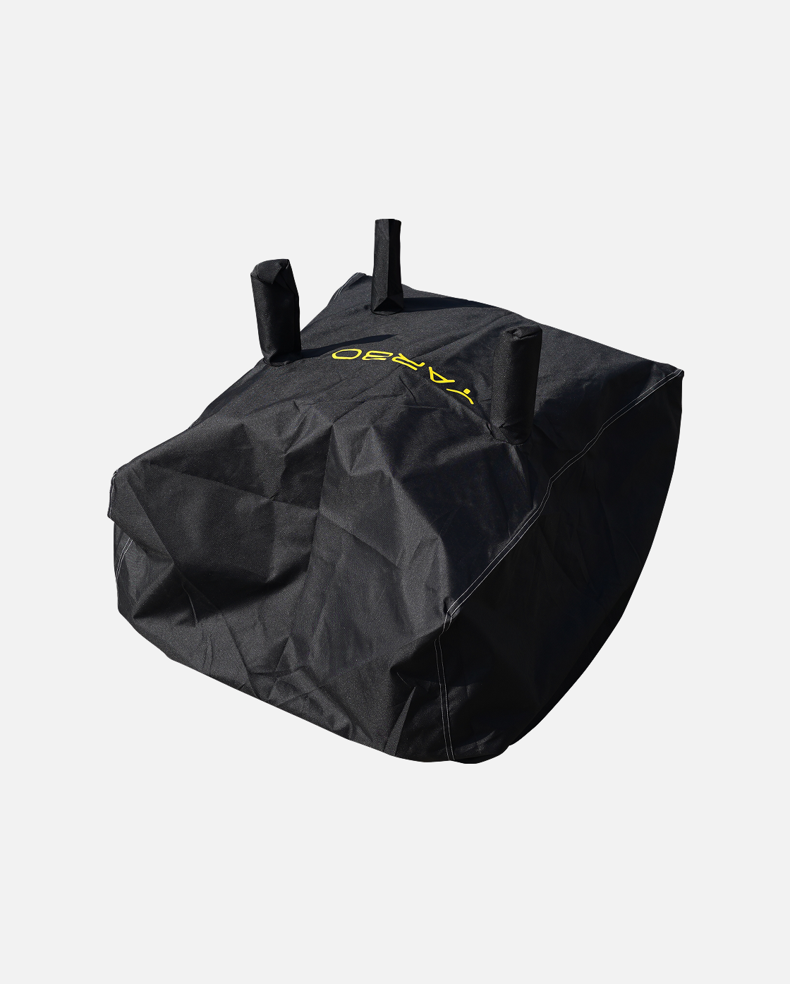 Black protective cover with yellow logo and three top handles, by YARD, shown in angled view with visible stitching and durable fabric texture.