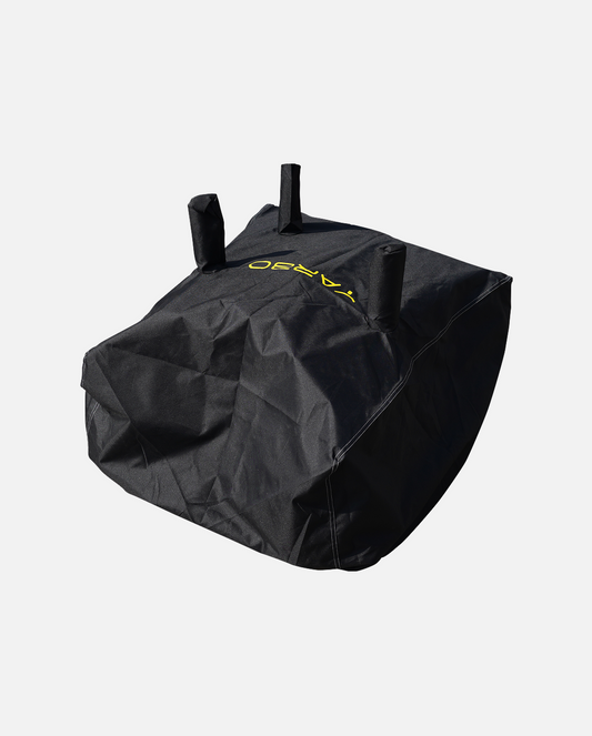 Black protective cover with yellow logo and three top handles, by YARD, shown in angled view with visible stitching and durable fabric texture.